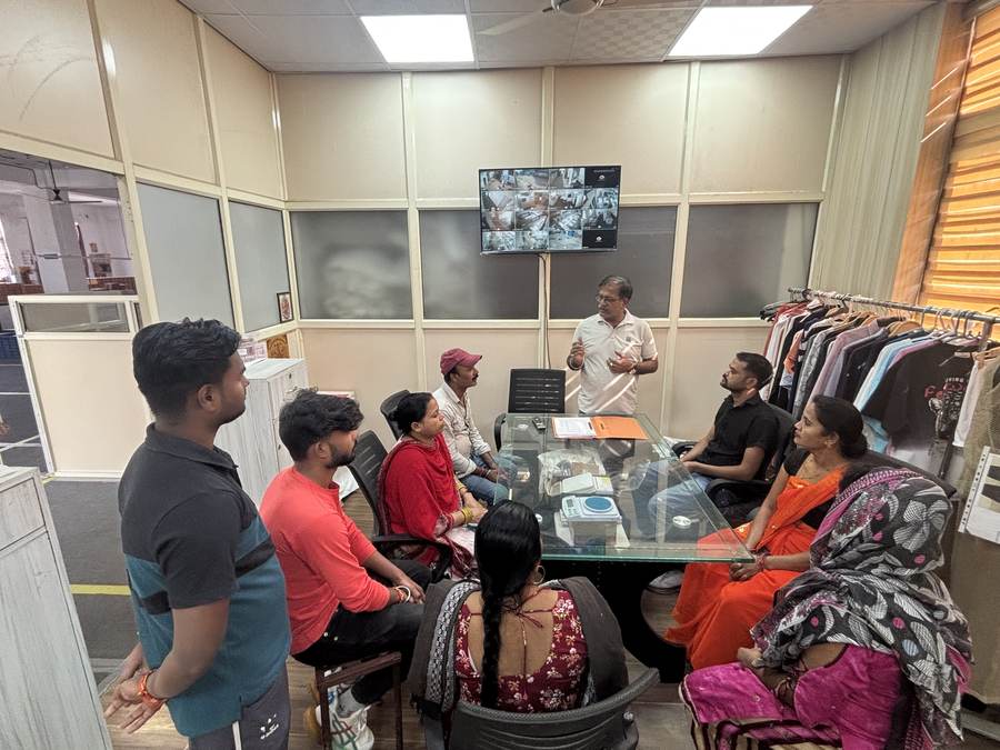 Staff training discussion in the production floor office